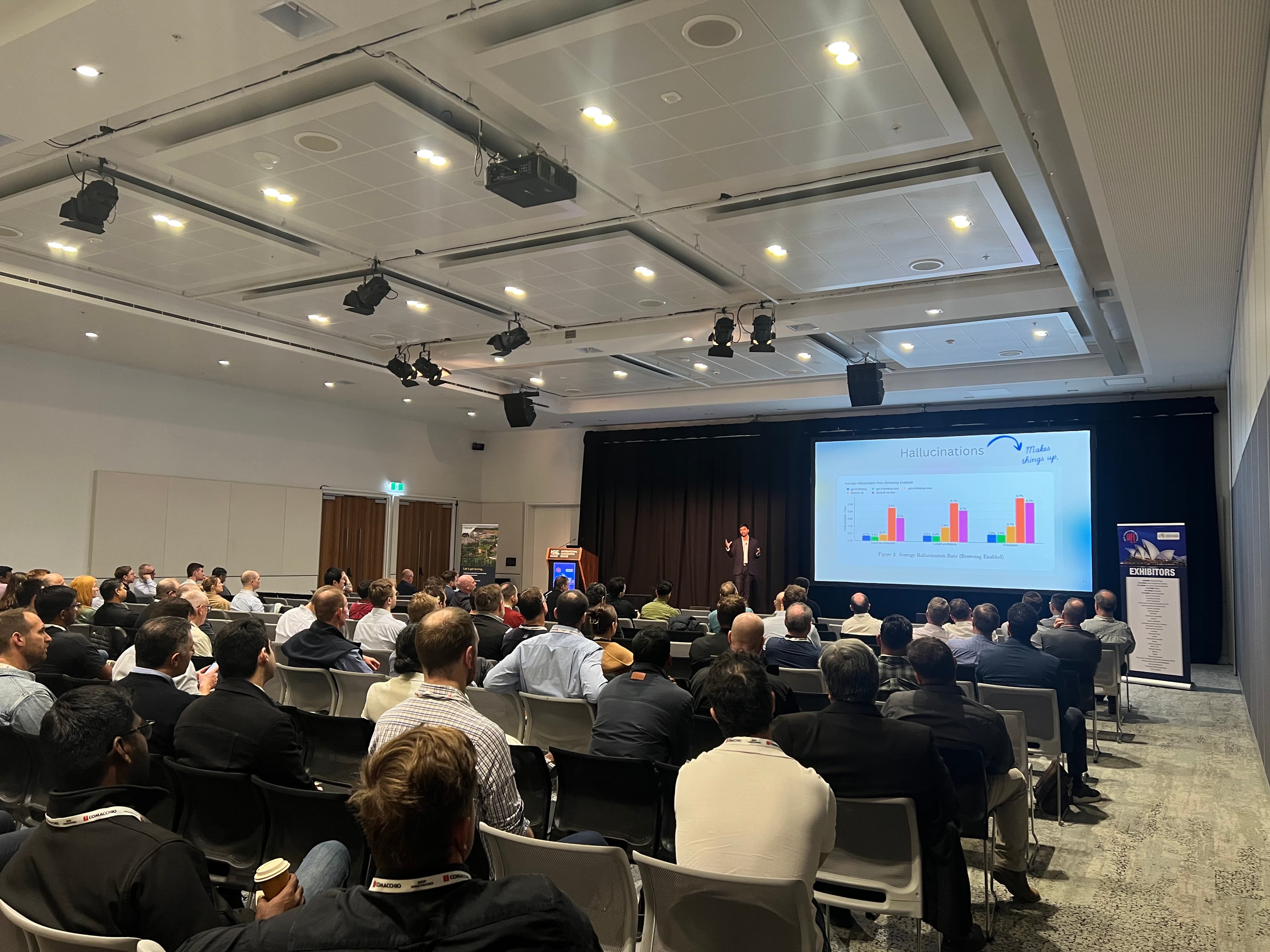Tam presenting on stage