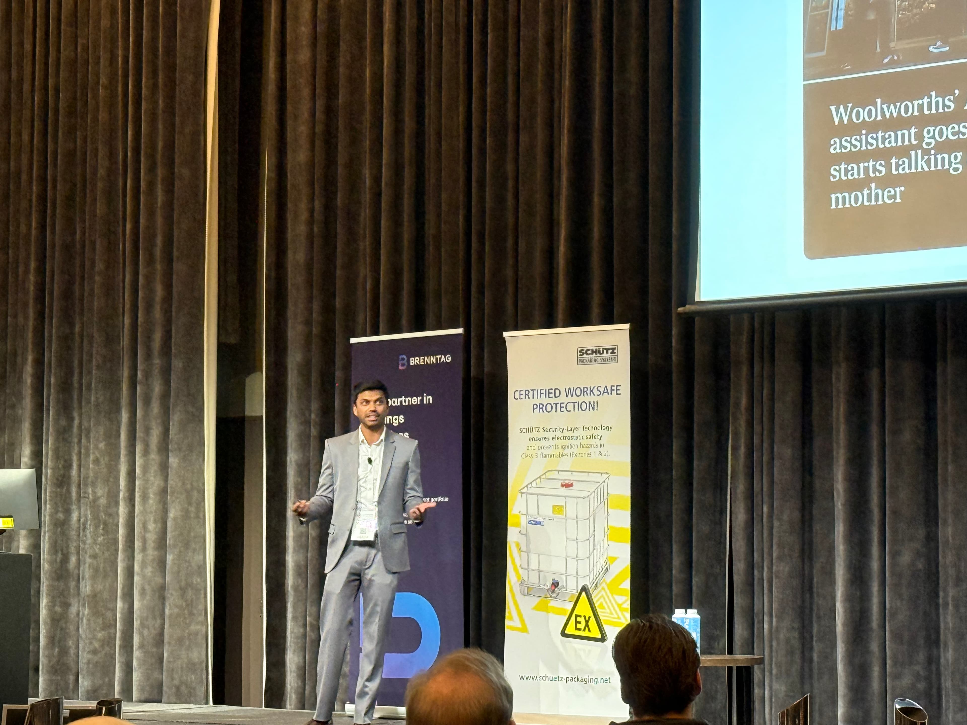 Tam presenting at a live industry event